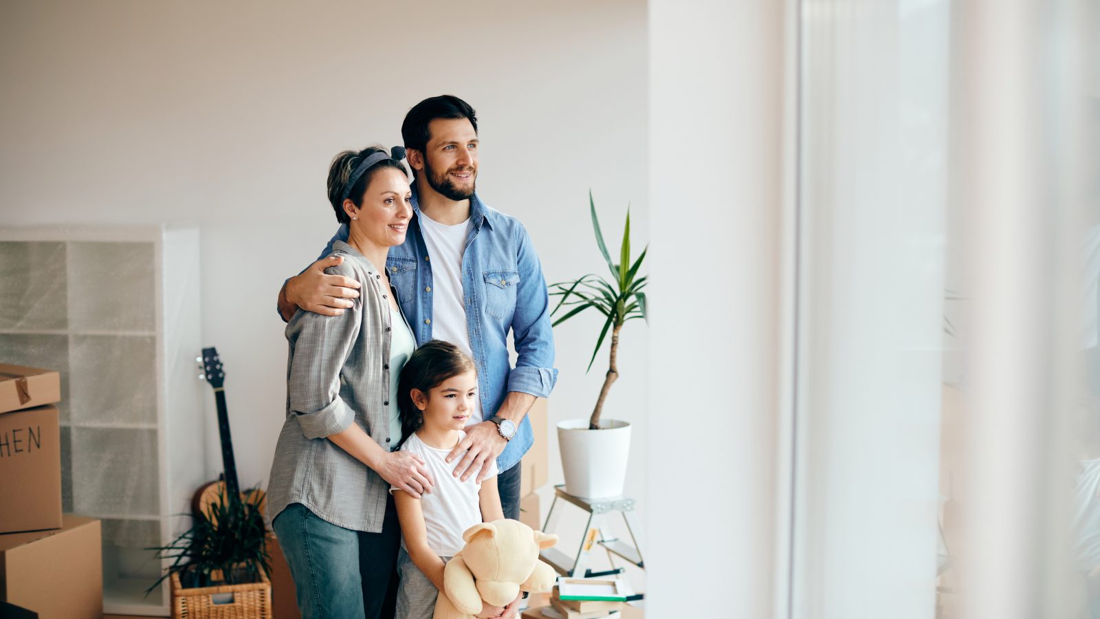 a family is moving into a new home at The Discovery Park Life Apartments