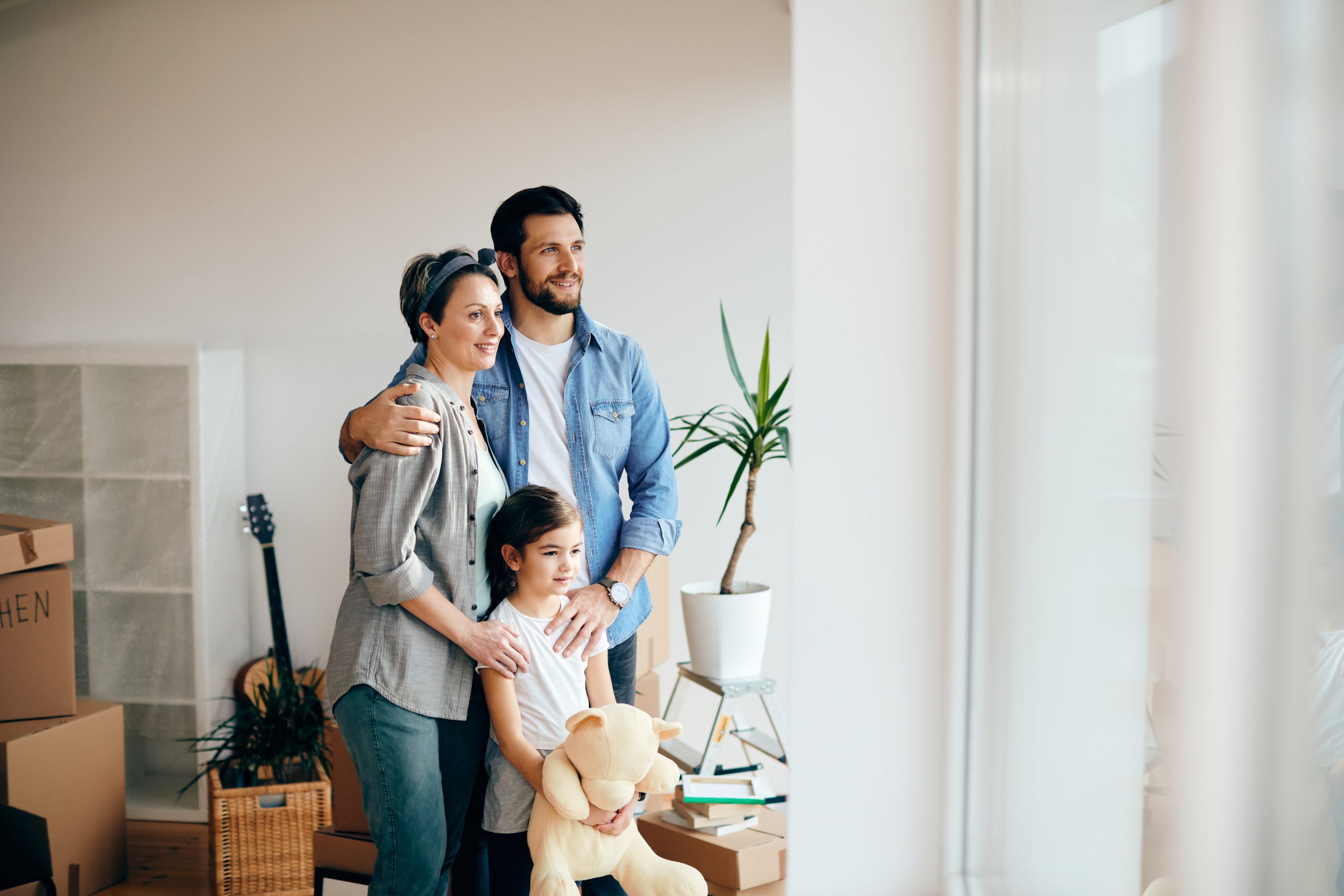 a family is moving into a new home at The Discovery Park Life Apartments