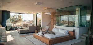 a bedroom with a large bed and glass walls at The  Discovery Park Life Apartments